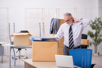 Old male employee in relocation concept