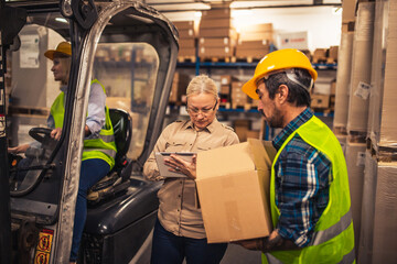 Group of workers working in a warehouse.