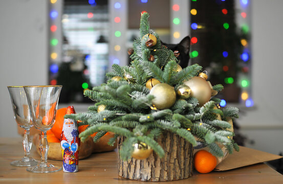 Natural herringbone with christmas decor and black cat on the table