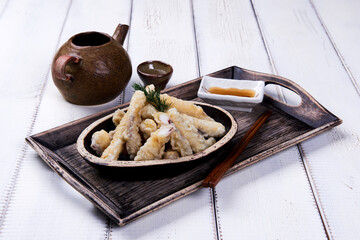 Fried squid on wood tray bright background