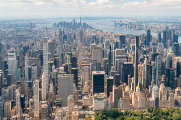 Aerial panoramic city view of Midtown Manhattan neighborhoods towards lower Manhattan and Downtown, Central Park on bottom, New York City. Bird's eye view from helicopter of metropolis cityscape