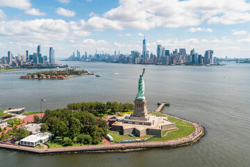 Aerial panoramic city view of Lower Manhattan, New York City, New Jersey City Downtown, and iconic Statue of Liberty. Bird's eye view from helicopter. © VideoFlow