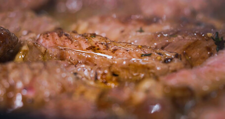 Obraz na płótnie Canvas Delicious Juicy Beef Meat Cooking Close Up