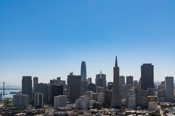 Panoramic view of San Francisco skyline at clear blue summer daytime from Coit Tower, Financial District and residential neighborhoods, California, United States.