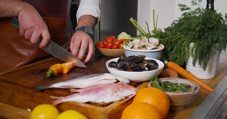 Fototapeta na wymiar Process of mediterranean dish preparation. Fresh Mollusks Fish Shell Shrimp. Cooking Seafood.