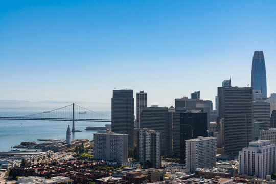 Panoramic view of San Francisco cityscape at clear blue summer daytime from Coit Tower, Financial District and residential neighborhoods, California, United States.