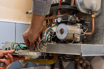 Professional setting up and servicing by heating systems installer