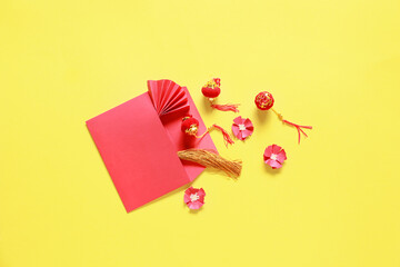 Red envelope with Chinese symbols on color background. New Year celebration