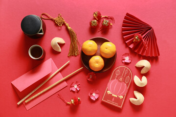 Red envelopes with Chinese symbols on color background. New Year celebration