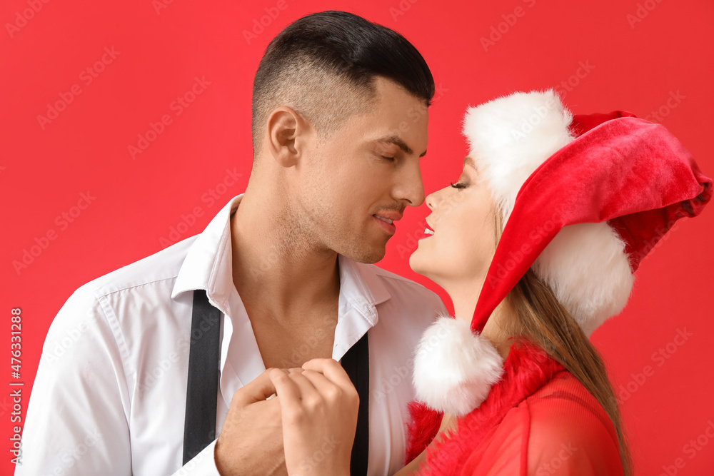 Sticker sexy young couple on color background. christmas celebration