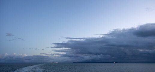 Dark Cloudscape over the West Coast of Pacific Ocean. Taken in British Columbia, Canada. Morning winter sunrise. Sky Nature Background