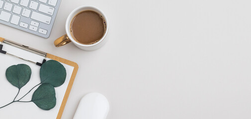 Office desk table top view with office supply, beige table with copy space, beige color workplace composition, flat lay