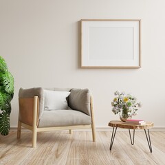 Square frame poster mockup with armchair and green plants on white wall background.