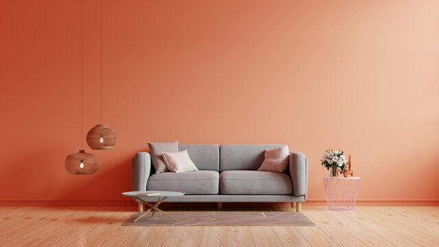 The interior has a sofa on empty calming coral wall background.