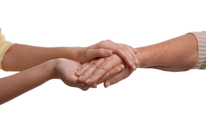 Young and elderly women holding hands together on white background, closeup