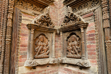 Carved wood figures in niches at Royal Palace, Sundari Chowk wing, Durbar Square, Patan, Kathmandu Valley, Nepal