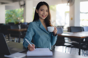 Business woman working to analyze technical price graph and indicator. account or saving money or insurance concept.