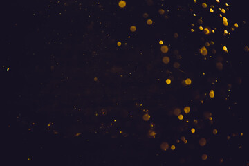 Abstract gold bokeh blur defocus with black background