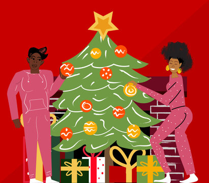Gay couple decorating Christmas tree