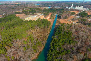 a stunning aerial shot of the Catawba River surrounded by vast miles of green and autumn colored...