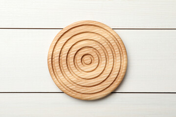 Stylish wooden cup coaster on white table, top view