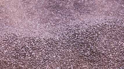 Smoke-roasted pebbles. Small black pebbles background in a built-in pan or pot for roasting Chinese...