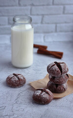 homemade round gingerbread with cinnamon powdered sugar with milk