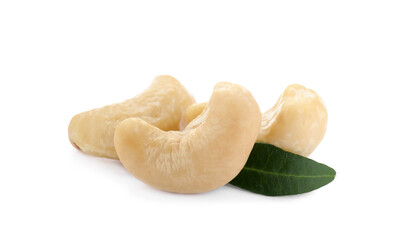 Tasty organic cashew nuts and green leaf isolated on white
