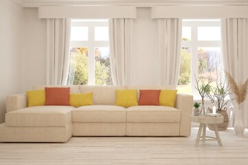 Fototapeta premium Stylish room in white color with sofa and autumn landscape in window. Scandinavian interior design. 3D illustration