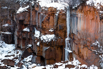 Frozen waterfall in a mountain canyon