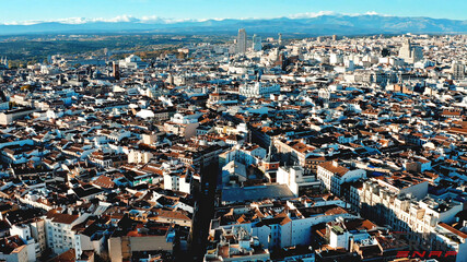 Amazing views of Madrid, Spain detailed architecture from the upside shot by flying drone brown roofs white walls capital metropolis blue sky cars vehicle beatiful buildings patterns