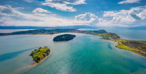 Sunny spring view from flying drone of Zvernec Beach. Breathtaking seascape of Adriatic sea. Majestic morning scene of Albania, Europe. Beauty of nature concept background.