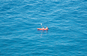 orange boat in the sea