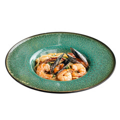 Isolated seafood spaghetti pasta with shrimp and mussels