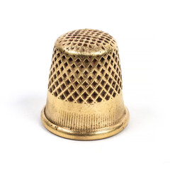 Metal thimble for sewing.