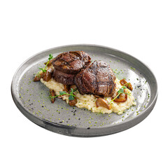 Gourmet veal medallions with risotto on wooden background