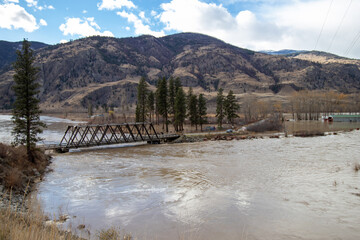Similkameen Valley, BC, Canada on November 16, 2021 water rising over the banks and flooding the...