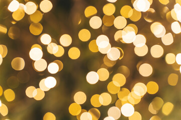  Golden bokeh background. Texture foil and confetti bokeh, light of golden dust. Festive party Christmas and new year's eve background.