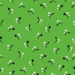 Vintage floral background. Seamless vector pattern for design and fashion prints. Elegant floral pattern with small white flowers on a green background.