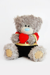 soft toy bear holding a red heart