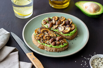 Bruschetta with mushrooms and avocados. Healthy eating. Vegetarian food. Keto diet.