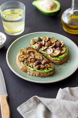 Bruschetta with mushrooms and avocados. Healthy eating. Vegetarian food. Keto diet.