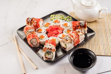 Set of different fresh tasty sushi rolls on white background