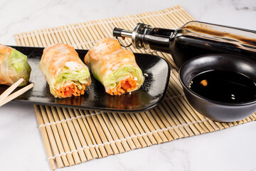 Fresh tasty sushi spring rolls with chicken and shrimps. Japanese cuisine
