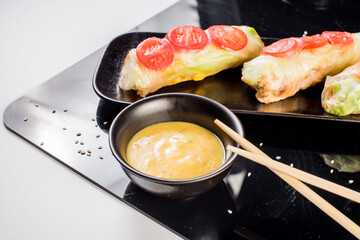 Fresh tasty sushi spring rolls with chicken and shrimps. Japanese cuisine