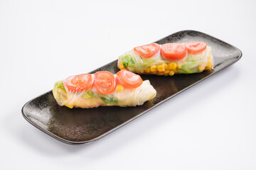 Fresh tasty sushi spring rolls with chicken and shrimps. Japanese cuisine