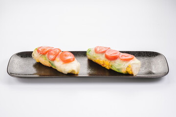 Fresh tasty sushi spring rolls with chicken and shrimps. Japanese cuisine