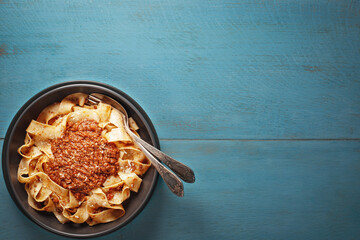 Pasta pappardelle with BOLOGNESE SAUCE with copy space