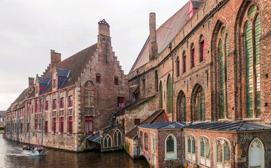 historic center with brick houses in the Belgian city of Bruges  - 476369620