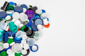 Heap of plastic caps on table